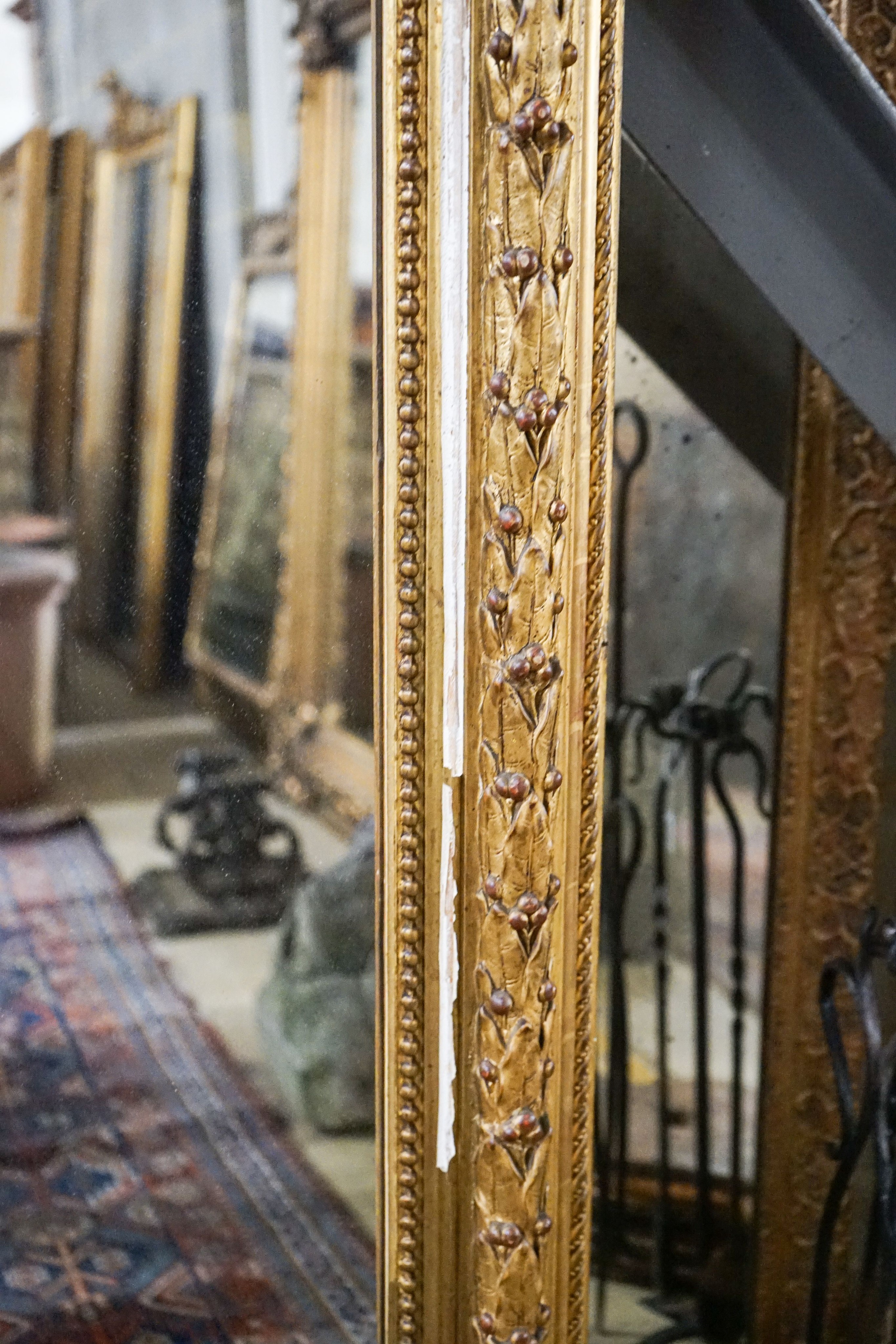 A Victorian giltwood and gesso overmantel mirror with arched scroll pediment, width 112cm, height 180cm